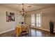 Cozy dining area with modern chandelier and French doors leading to backyard at 1045 S Solomon St, Mesa, AZ 85204