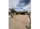 Single-story home with covered parking, neutral exterior, and low-maintenance landscaping at 1045 S Solomon St, Mesa, AZ 85204