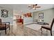 Open-concept living space featuring wood floors and seamless transition to dining and kitchen at 1045 S Solomon St, Mesa, AZ 85204