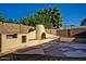 A custom outdoor kitchen with bar-style seating on a unique decorative stained concrete patio at 1045 S Solomon St, Mesa, AZ 85204