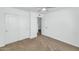 Bright bedroom with a ceiling fan and a large closet with sliding doors at 10590 E Mercer Ln, Scottsdale, AZ 85259