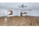Open-concept living room showcasing wood-look tile flooring with ample space for gatherings at 10590 E Mercer Ln, Scottsdale, AZ 85259