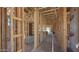Unfinished home interior with wooden framework showcasing open layout and potential for personalized design at 11338 E Utah Ave, Mesa, AZ 85212