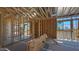Unfinished living room showcasing the home's wooden frame and the design ready for customization at 11338 E Utah Ave, Mesa, AZ 85212