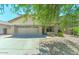 Charming single-story home featuring a two-car garage and well-maintained gravel landscaping at 11633 W Jefferson St, Avondale, AZ 85323