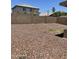 The backyard is rockscaped and surrounded by a block wall at 12138 W Flores Dr, El Mirage, AZ 85335