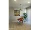 Charming dining area with tile floors, a small table and chairs, and a window offering natural light at 12138 W Flores Dr, El Mirage, AZ 85335