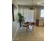 Cozy breakfast nook featuring tile flooring, a small table with seating, and bright natural light at 12138 W Flores Dr, El Mirage, AZ 85335