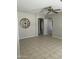 Open living room with neutral paint, tile floors, decorative fan, and lots of natural light at 12138 W Flores Dr, El Mirage, AZ 85335