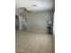 Spacious living room with neutral paint, tile floors, a ceiling fan, and good natural light at 12138 W Flores Dr, El Mirage, AZ 85335