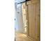 Bathroom view showcasing a light wood sliding door, neutral wall color, and modern fixtures at 1304 E Hackamore St, Mesa, AZ 85203