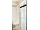 Bathroom featuring a shower, toilet, and a door with hooks, designed for functionality and convenience at 1304 E Hackamore St, Mesa, AZ 85203