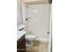 Bright bathroom featuring a white shower and toilet along with neutral tile flooring at 1304 E Hackamore St, Mesa, AZ 85203