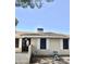 Charming home exterior featuring a dark wood front door, storm door, and security screen at 1304 E Hackamore St, Mesa, AZ 85203
