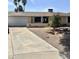 Single-story home with desert landscaping, a driveway, attached garage, and a welcoming front entrance at 1304 E Hackamore St, Mesa, AZ 85203