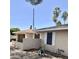 Charming home exterior featuring a low block wall, tan stucco and tidy yard, offering comfortable living at 1304 E Hackamore St, Mesa, AZ 85203