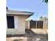 Charming home exterior featuring a low block wall, tan stucco and tidy yard, offering comfortable living at 1304 E Hackamore St, Mesa, AZ 85203