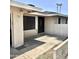 Charming home exterior featuring a dark wood front door, storm door, and security screen at 1304 E Hackamore St, Mesa, AZ 85203