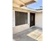 Inviting front entrance with a dark wood door, storm door, and security screen, enhanced by a tiled porch at 1304 E Hackamore St, Mesa, AZ 85203