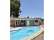 Inviting backyard pool with a unique design, offering a private and serene outdoor space at 1304 E Hackamore St, Mesa, AZ 85203