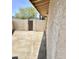 Cemented side yard with secured gate, offering a private outdoor area and easy access at 1304 E Hackamore St, Mesa, AZ 85203