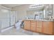 Bathroom featuring a glass-enclosed shower, tile flooring, vanity with sink and storage at 15040 W Windrose Dr, Surprise, AZ 85379