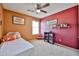 Bedroom with carpet floors, neutral tone walls, window, bed and decorations at 15040 W Windrose Dr, Surprise, AZ 85379