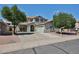 Charming two-story home with a well-maintained front yard and desert landscaping at 15040 W Windrose Dr, Surprise, AZ 85379