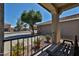 Relaxing front porch featuring a swing bench, decorative plants, and an inviting view at 15040 W Windrose Dr, Surprise, AZ 85379