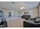Upstairs living area with seating and television at 15040 W Windrose Dr, Surprise, AZ 85379