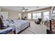 Main bedroom with bay window, desk, chair and bed, offering a comfortable and relaxing space at 15040 W Windrose Dr, Surprise, AZ 85379