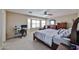 The main bedroom features a bay window, desk, and comfortable seating creating a personal retreat at 15040 W Windrose Dr, Surprise, AZ 85379