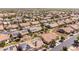 Panoramic aerial view of a well-planned community with desert landscaping and mountain views at 1552 E Manor Dr, Casa Grande, AZ 85122