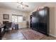 Bedroom boasts a built-in Murphy bed and an adjacent workstation near a sunlit window at 1552 E Manor Dr, Casa Grande, AZ 85122