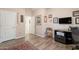 Bedroom features hard flooring, neutral walls, a chair and built-in cabinet for storage or decor at 1552 E Manor Dr, Casa Grande, AZ 85122