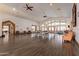 Spacious community room with wood floors, plenty of windows, and comfortable seating at 1552 E Manor Dr, Casa Grande, AZ 85122