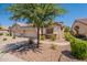 Charming single-story home features a 3-car garage and well-maintained desert landscaping at 1552 E Manor Dr, Casa Grande, AZ 85122