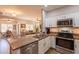 Kitchen flows into living and dining spaces, offering open floor plan at 1552 E Manor Dr, Casa Grande, AZ 85122