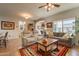 Open floor plan boasts two seating areas, tile floors, and lots of natural light at 1552 E Manor Dr, Casa Grande, AZ 85122