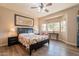 Main bedroom with natural light, ceiling fan and warm color palette at 1552 E Manor Dr, Casa Grande, AZ 85122