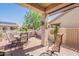 Covered patio with dining table set offers a relaxed outdoor living space at 1552 E Manor Dr, Casa Grande, AZ 85122
