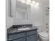 Bathroom featuring a single sink vanity with grey cabinets and granite countertop at 1600 N Saba St # 151, Chandler, AZ 85225