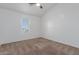 Bedroom featuring carpeted floors and a large window allowing for natural light at 1600 N Saba St # 151, Chandler, AZ 85225