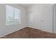 Neutral bedroom featuring a window and closet with sliding doors at 1600 N Saba St # 151, Chandler, AZ 85225
