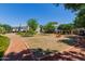 A community park with trees and walking path between residential areas at 1600 N Saba St # 151, Chandler, AZ 85225
