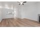 Spacious living area with wood floors, open to the kitchen, providing a connected living space at 1600 N Saba St # 151, Chandler, AZ 85225