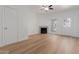 Open living room featuring wood-style flooring, fireplace, and a bright window at 1600 N Saba St # 151, Chandler, AZ 85225