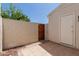 Enclosed patio area offering a private outdoor storage space with a wooden gate at 1600 N Saba St # 151, Chandler, AZ 85225