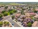 Panoramic view of the community with homes, trees, and street layout in residential area at 16118 W Port Au Prince Ln, Surprise, AZ 85379