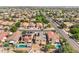 Overhead view of a residential area featuring various homes, street and some landscaping at 16118 W Port Au Prince Ln, Surprise, AZ 85379